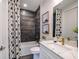 Clean bathroom with dark tile shower and white vanity at 719 Maldives Trl, Sarasota, FL 34234