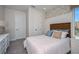 Bright bedroom with a comfortable bed and coastal decor at 719 Maldives Trl, Sarasota, FL 34234