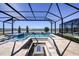 Resort-style pool and spa with fire pit and lake view at 719 Maldives Trl, Sarasota, FL 34234