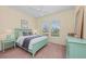 Bedroom with light teal dresser and a double bed at 7204 Annanhill Ln, Lakewood Ranch, FL 34202