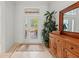 Bright and airy entryway with tile flooring and a wooden cabinet at 7204 Annanhill Ln, Lakewood Ranch, FL 34202