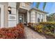 Welcoming front entry with a brick walkway and landscaping at 7204 Annanhill Ln, Lakewood Ranch, FL 34202