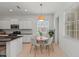 Modern kitchen with breakfast nook and white cabinetry at 7204 Annanhill Ln, Lakewood Ranch, FL 34202