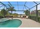 Relaxing pool and spa area with lake view at 7204 Annanhill Ln, Lakewood Ranch, FL 34202