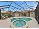 Inviting screened pool and spa with view of house at 7204 Annanhill Ln, Lakewood Ranch, FL 34202