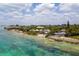 Aerial footage showing coastline, ocean, and houses at 7314 Point Of Rocks Rd, Sarasota, FL 34242