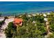 Luxury beachfront home with stunning ocean views and tropical landscaping at 7314 Point Of Rocks Rd, Sarasota, FL 34242