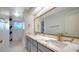 Bathroom features a double vanity, granite countertops and modern gold faucets at 7324 Phillips St, Sarasota, FL 34243