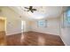 Bedroom with hardwood floors, ceiling fan, and ensuite bathroom at 7324 Phillips St, Sarasota, FL 34243