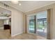 Dining area with sliding glass doors leading to the screened-in pool area, offering seamless indoor-outdoor living at 7324 Phillips St, Sarasota, FL 34243