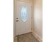 Classic white front door with decorative glass insert at 7324 Phillips St, Sarasota, FL 34243