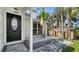 Inviting front porch featuring stone accents and lush greenery at 7324 Phillips St, Sarasota, FL 34243