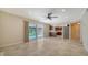 Living room area with fireplace, tile flooring, and sliding glass doors leading to the pool at 7324 Phillips St, Sarasota, FL 34243