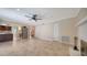 Open living area with tile flooring, a brick fireplace, and kitchen at 7324 Phillips St, Sarasota, FL 34243