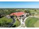 Aerial view of clubhouse and golf course at 7503 Calle Facil, Sarasota, FL 34238