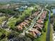 Aerial view of upscale homes situated along a waterway and golf course at 7503 Calle Facil, Sarasota, FL 34238