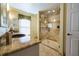 Large bathroom with a walk-in shower and double vanity at 7503 Calle Facil, Sarasota, FL 34238