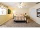 Bright bedroom featuring a floral bedspread and ceiling fan at 7503 Calle Facil, Sarasota, FL 34238