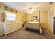 Bedroom with full bed, ceiling fan and dresser at 7503 Calle Facil, Sarasota, FL 34238