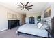 Spacious bedroom with dark wood furniture and ceiling fan at 7503 Calle Facil, Sarasota, FL 34238