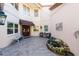 Charming courtyard entry with seating area at 7503 Calle Facil, Sarasota, FL 34238