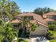 Two-story house with tile roof and attached garage at 7503 Calle Facil, Sarasota, FL 34238