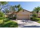 Two-story house with attached garage and manicured lawn at 7503 Calle Facil, Sarasota, FL 34238