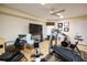 Home gym, complete with treadmill, exercise bike, and rowing machine at 7503 Calle Facil, Sarasota, FL 34238