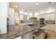 Gourmet kitchen with granite countertops and stainless steel appliances at 7503 Calle Facil, Sarasota, FL 34238