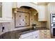 Stylish kitchen with granite countertops and tile backsplash at 7503 Calle Facil, Sarasota, FL 34238