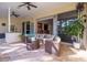 Relaxing outdoor patio with wicker furniture and access to the interior at 7503 Calle Facil, Sarasota, FL 34238