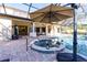 Inviting pool area with spa and covered patio at 7503 Calle Facil, Sarasota, FL 34238