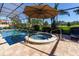 Relaxing pool and spa with covered patio at 7503 Calle Facil, Sarasota, FL 34238