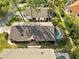 An aerial view of the house showing the backyard with pool and screened enclosure at 7755 Pine Trace Dr # 7755, Sarasota, FL 34243