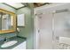 Bright bathroom with shower and vanity at 7755 Pine Trace Dr # 7755, Sarasota, FL 34243