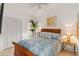 Bedroom with wooden bed frame and coastal decor at 7755 Pine Trace Dr # 7755, Sarasota, FL 34243