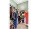 Large walk-in closet with ample shelving and hanging space at 7755 Pine Trace Dr # 7755, Sarasota, FL 34243