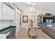 Bright dining area with glass table and chandelier at 7755 Pine Trace Dr # 7755, Sarasota, FL 34243