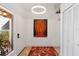 Bright entryway with large Buddha painting and tile floor at 7755 Pine Trace Dr # 7755, Sarasota, FL 34243