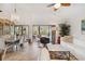 Open living and dining area with access to patio and pool at 7755 Pine Trace Dr # 7755, Sarasota, FL 34243