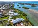 Panoramic aerial view of waterfront homes and beautiful coastal community at 935 Bayshore Rd, Nokomis, FL 34275