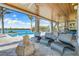 Gorgeous outdoor seating area features comfortable seating and breathtaking views of the pool and waterfront at 935 Bayshore Rd, Nokomis, FL 34275