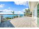 Spacious waterfront patio with stunning views of the water and lush landscaping at 935 Bayshore Rd, Nokomis, FL 34275