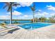 Beautiful waterfront pool and spa offers an oasis surrounded by palm trees and lush landscaping at 935 Bayshore Rd, Nokomis, FL 34275