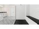 Spa-like bathroom with a large walk-in shower and black pebble floor at 1012 Fernleaf Run, Bradenton, FL 34212