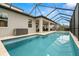 Screened-in pool with a covered patio and beautiful landscaping at 1012 Fernleaf Run, Bradenton, FL 34212