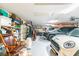 Garage with multiple vehicles and ample storage at 1130 Anclote Rd Rd, Tarpon Springs, FL 34689