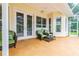 Spacious patio with french doors and wicker seating at 1130 Anclote Rd Rd, Tarpon Springs, FL 34689