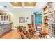 Cozy sitting area with leather armchairs, stone fireplace, and built-in shelves at 1130 Anclote Rd Rd, Tarpon Springs, FL 34689