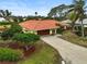 Single-Gathering home with terracotta roof and attached garage at 1212 Windward Dr, Osprey, FL 34229